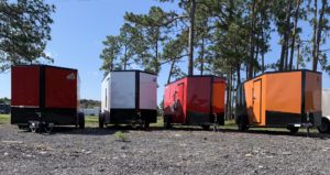 Many brands, many colors of enclosed trailers.